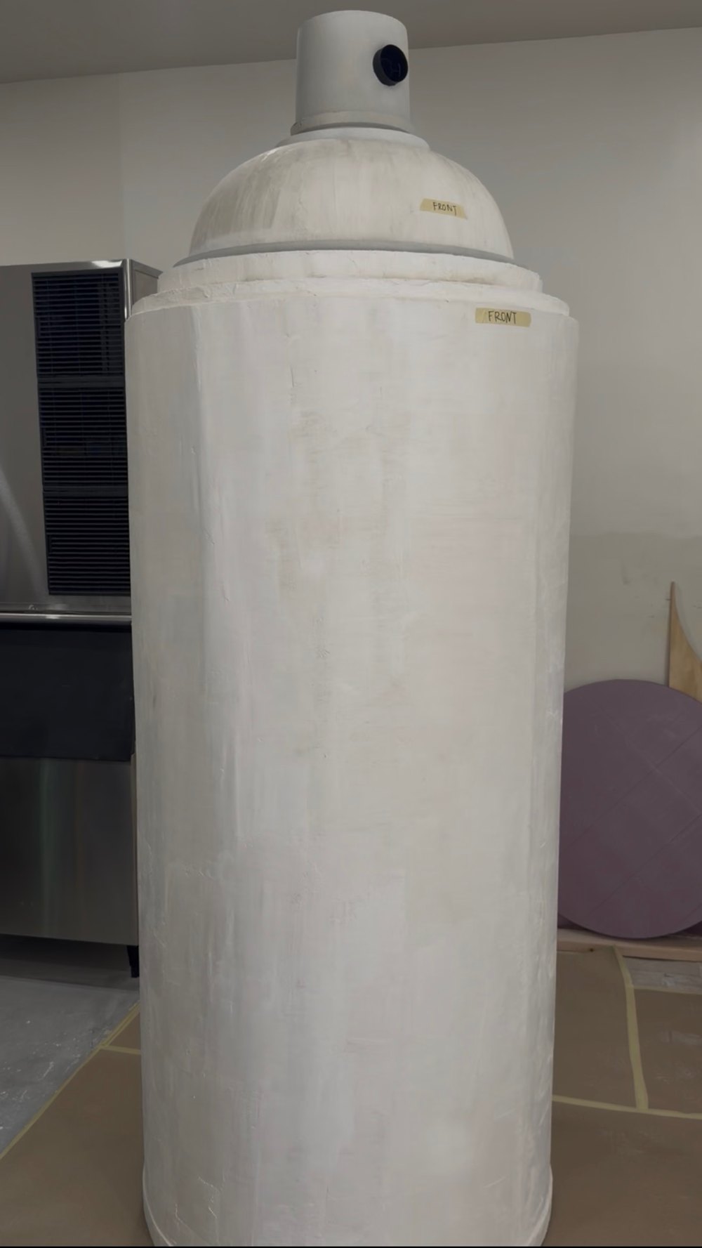 Oversized spray can prop in the workshop